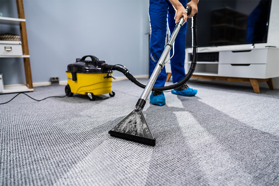man cleaning a carpet friendswood tx